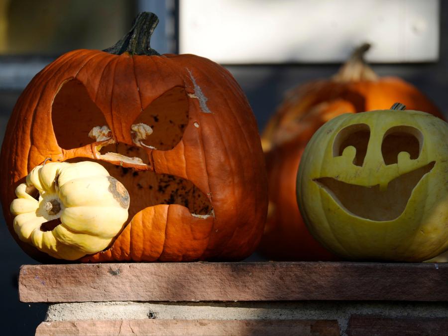 Pumpkins carved to mark Halloween are displayed outside a home in Denver, Colorado, on Friday, Oct. 27, 2023. David Zalubowski/The Associated Press