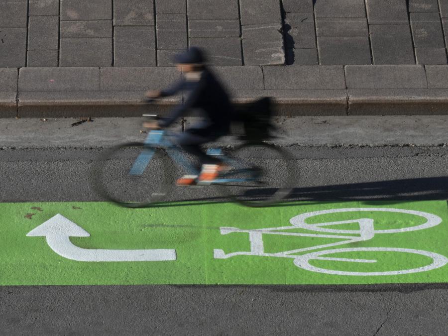A cyclist makes their way along a roadway in a lane marked for bicycles in Ottawa. Adrian Wyld/The Canadian Press