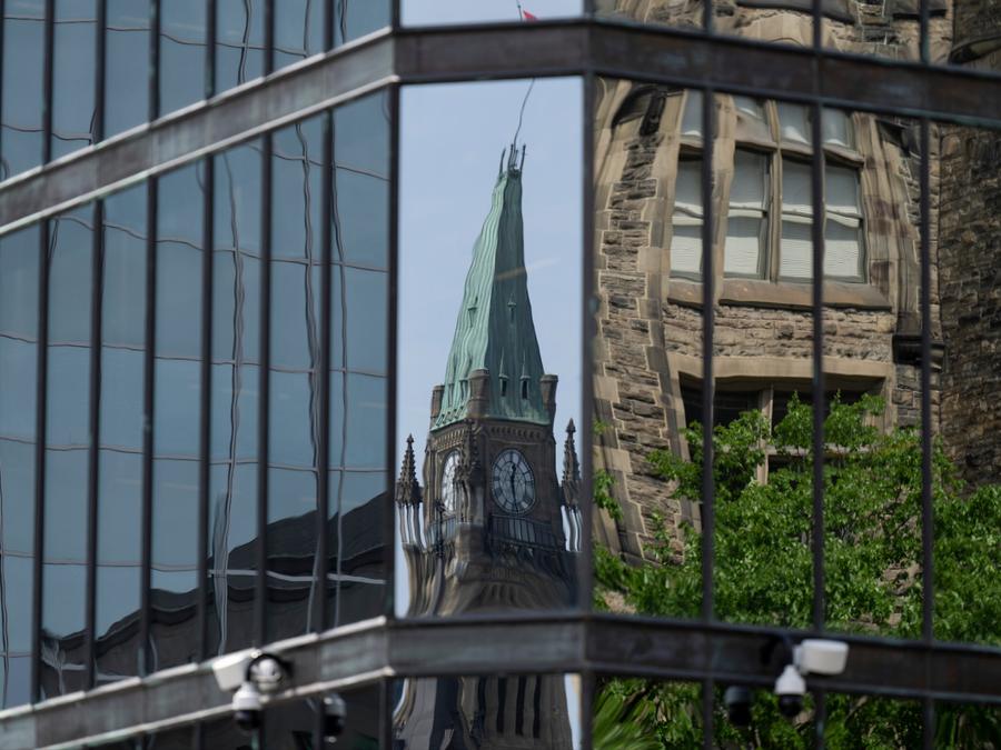 The Peace Tower on Parliament Hill is reflected in the windows of the Bank of Canada. Adrian Wyld/The Canadian Press